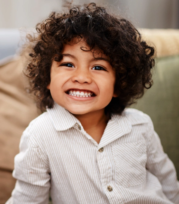 Child smiling during a pediatric dental visit at Village Green Dental Care