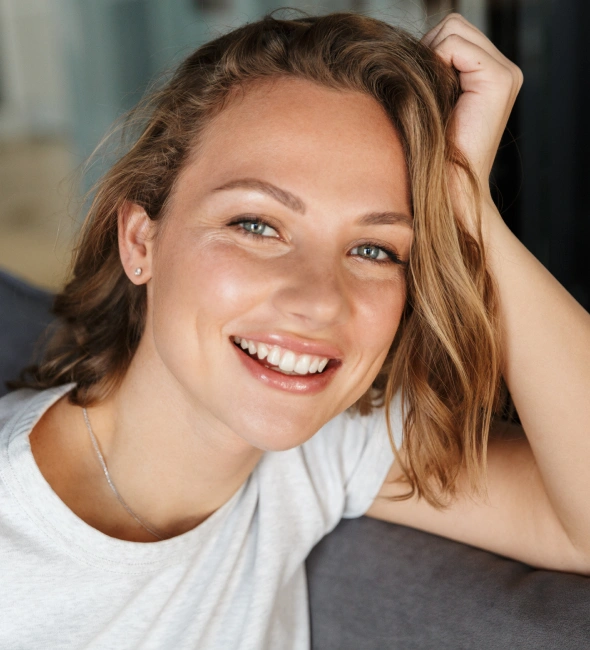 Patient smiling after cosmetic dental treatment at Village Green Dental Care