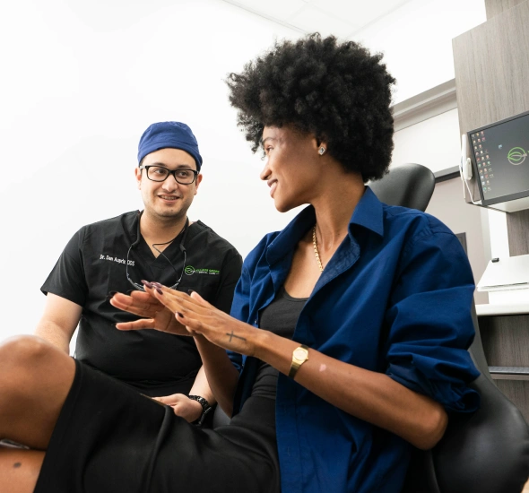 Dentist discussing oral health during a routine dental exam