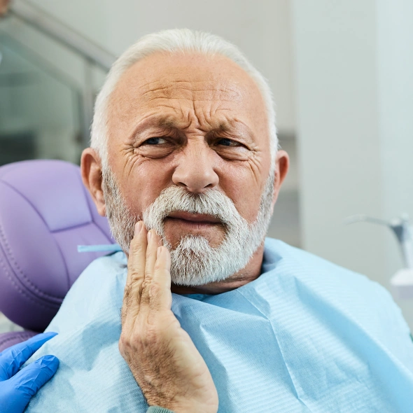 Patient consulting with a dentist about tooth extraction treatment