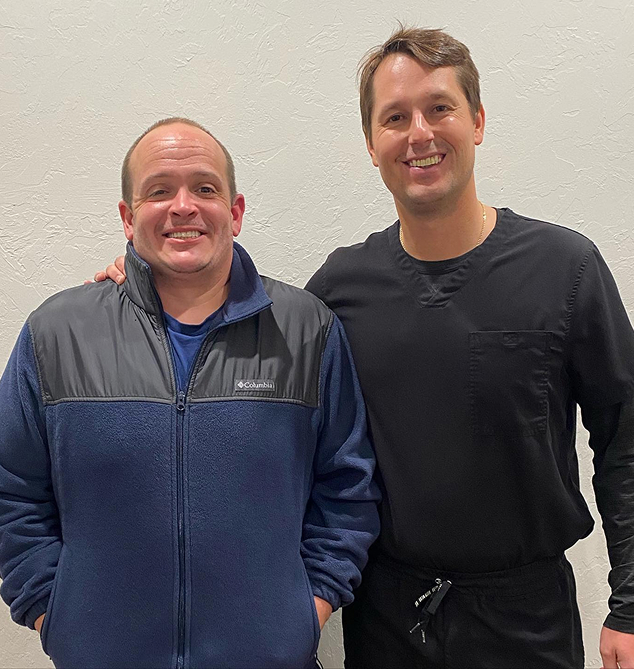 Dr David Lawrence with his patient after the dental implant procedure at Warwick Dental Oklahoma City, OK
