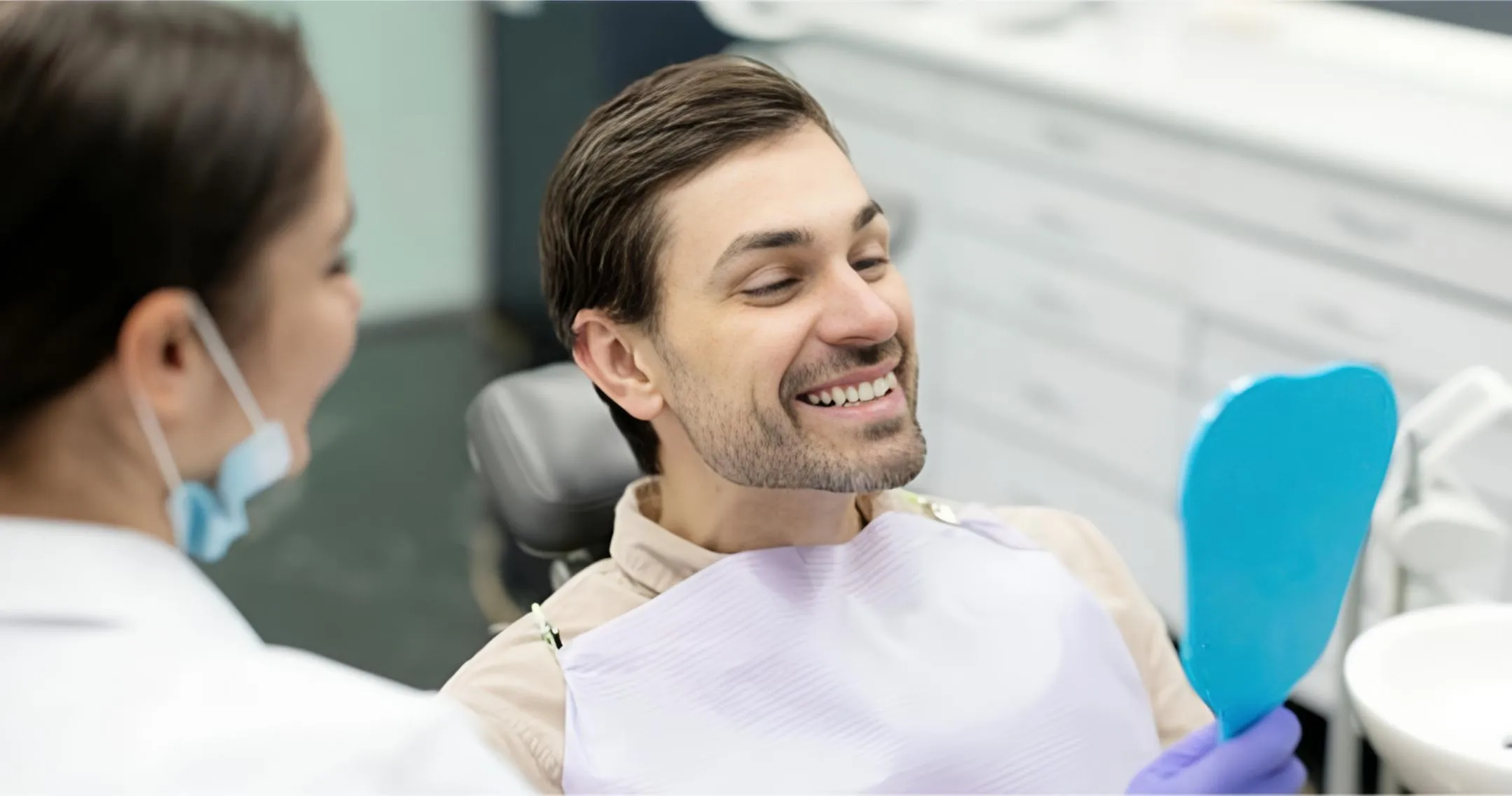 happy patient with dental assistant at Warwick Dental