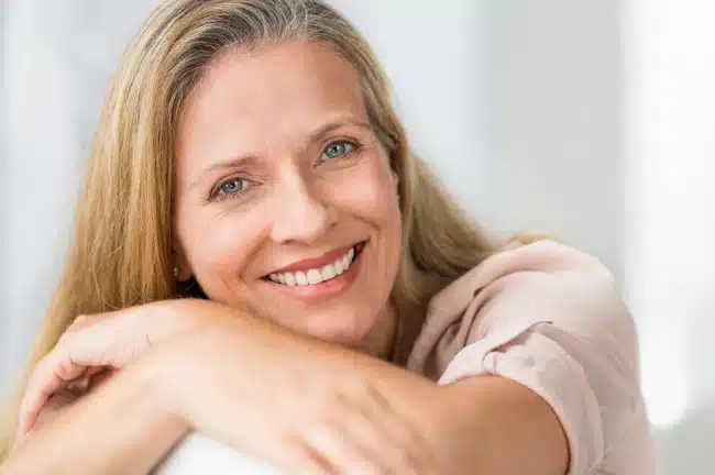 Woman smiling confidently after restorative dental treatment at Willow Street Dental in Chippewa Falls, WI