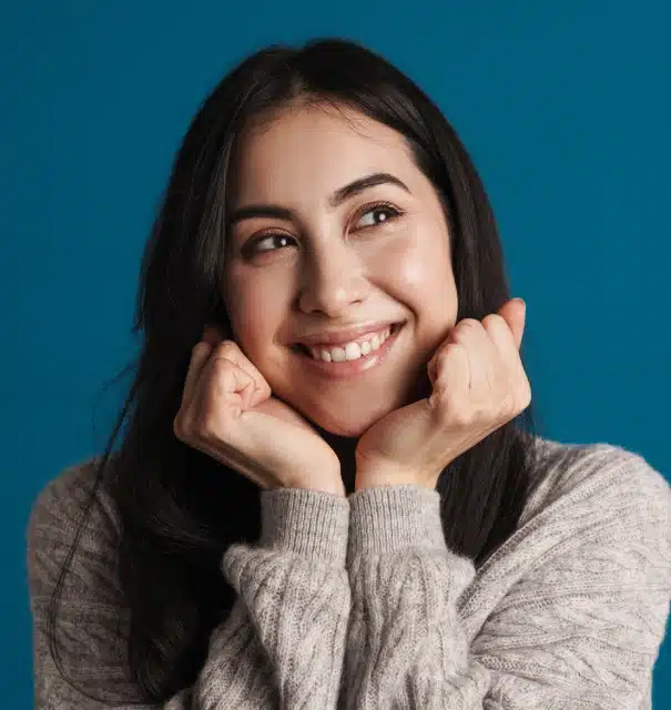 Woman smiling brightly after teeth whitening treatment at Willow Street Dental in Chippewa Falls, WI