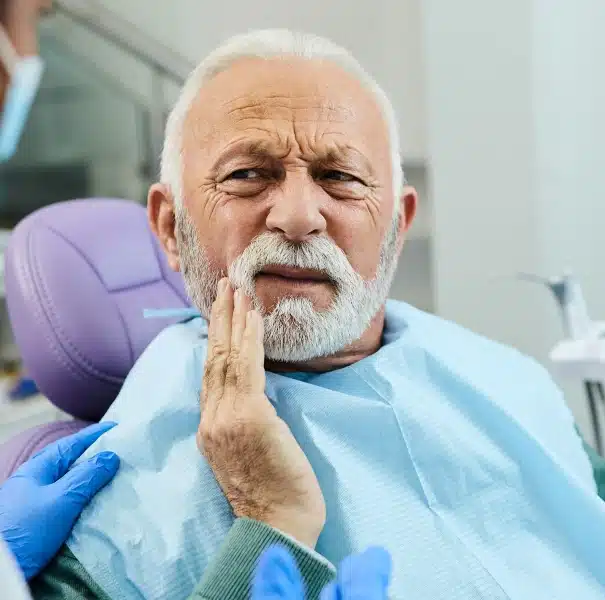Senior patient visiting Willow Street Dental in Chippewa Falls, WI for damaged tooth extraction