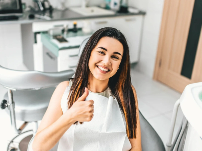 Woman smiling after dental cropown treatment in The Woodlands, TX - Dentistry and Orthodontics