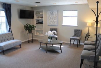 Welcoming dental practice waiting room in Aurora, IL with comfortable seating and modern decor.